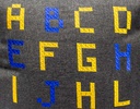 COJÍN NEGRO CON LETRAS (45×45cm)